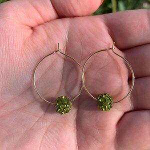 NWOT gold wire hoop earrings and green sparkle bead.